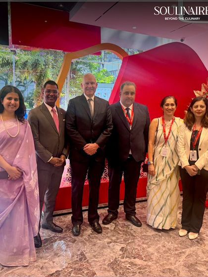 Our team posing with executives at a corporate event, showcasing our successful partnership. We build strong relationships with our clients through exceptional service.