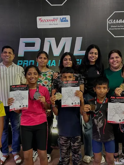 The next generation of champions with their families after a successful run at the PML National MMA Championship. We celebrate wins as a community, with parents and coaches supporting our young athletes.