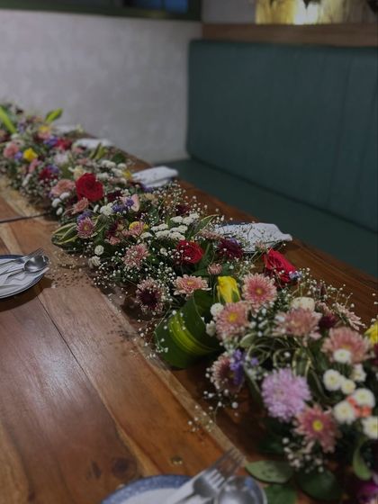 Another angle of the long floral arrangement, which served as a beautiful centerpiece for the entire table.