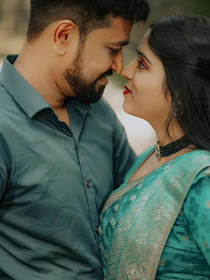 An intimate close-up shot. This photo focuses on the loving gaze shared between the couple, highlighting their connection.