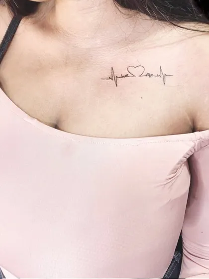 A heartbeat EKG line with a heart shape on the collarbone.