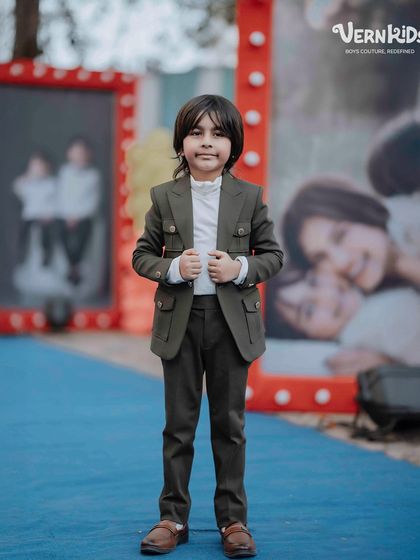 Posing for the camera. Our coordinated shacket sets are perfect for family photoshoots, parties, or any occasion where you want your boys to share a special look.