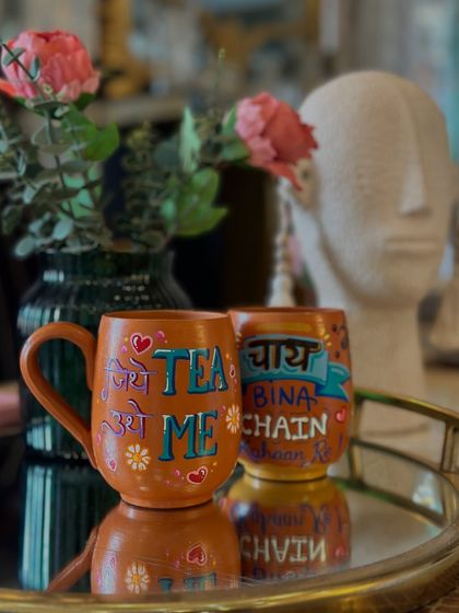 Another one of our fun terracotta tea mugs, this one saying "You, Me, and a cup of Tea" in a mix of English and Hindi text.