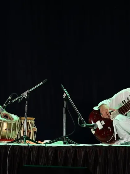 Performing a sitar and tabla duet at the centenary celebration in Aurangabad. The stage was set for a night of remembrance and musical offering.