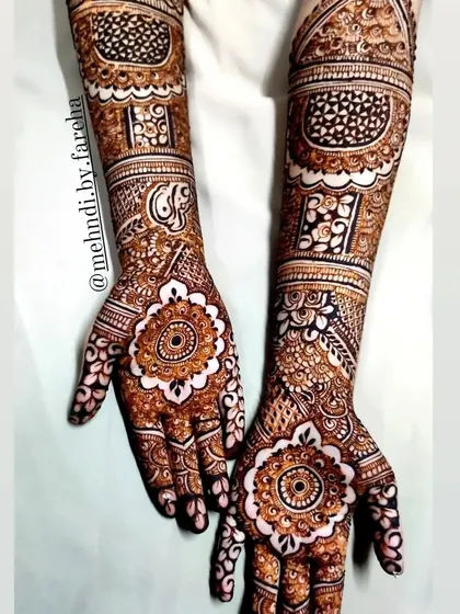 This bridal design incorporates large cutwork mandalas on the palms, creating a bold focal point.