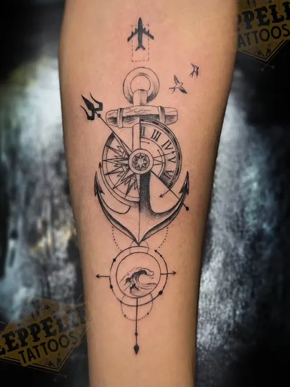 This fine-line tattoo was created for a client with a passion for travel. It combines an anchor for stability, a compass for direction, and other travel symbols into a single, clean design on the forearm, showing how multiple ideas can be woven into one cohesive piece.