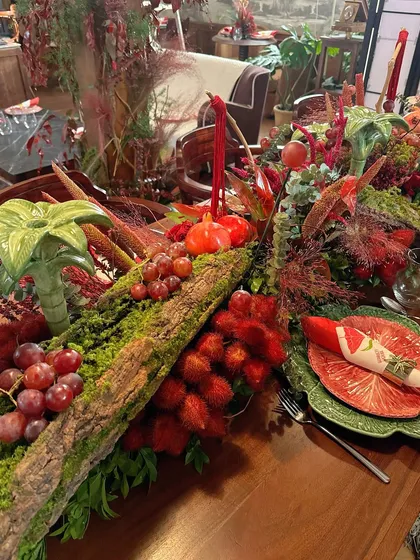 Another perspective of the rich and textured tablescape, showing the interplay of colors and natural elements.
