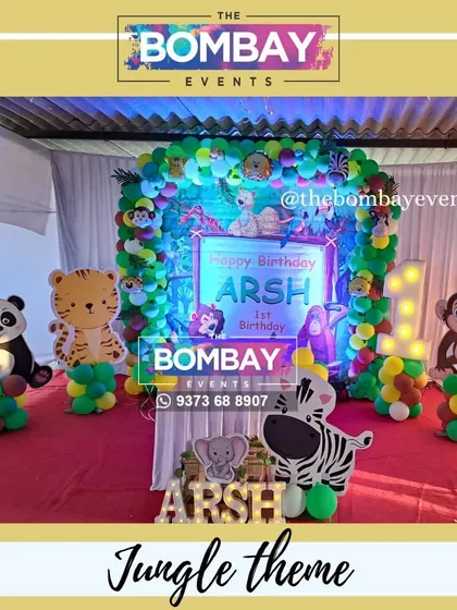 A closer look at the details of this jungle theme, including a custom-printed backdrop, a light-up number '1', and adorable cutouts of a panda, tiger, and monkey to bring the wild adventure to life.