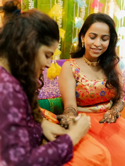 A behind-the-scenes moment of me applying mehendi to this lovely bride.