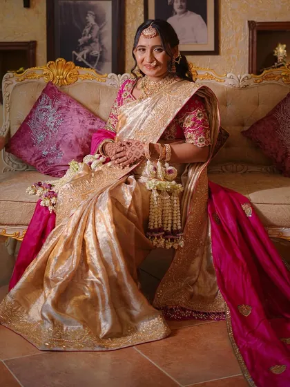 A full-length shot of the mother-to-be, seated gracefully with her floral accessories.