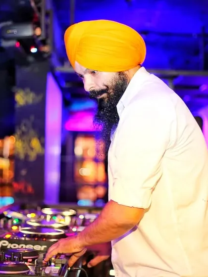 In the zone, mixing tracks on my Pioneer decks at a club. I believe music is a gift, and I treat every performance with focus and passion to deliver the best sound experience.
