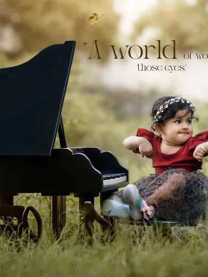 A world of wonder in those eyes. A little girl in a red dress looks thoughtfully at her mini piano during an outdoor session.
