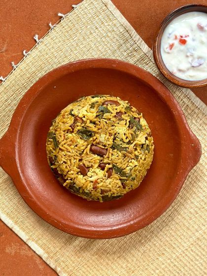 Another view of my prize-winning rajma and moringa pulav, served with a side of raita. It's a wholesome and balanced meal, perfect for new mothers.