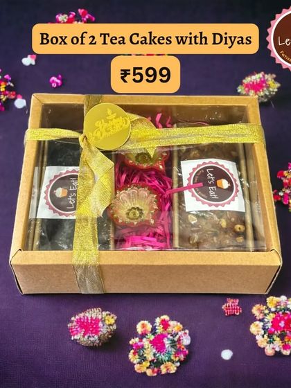 This beautifully wrapped box of two tea cakes with diyas shows the care I put into packaging. The gold ribbon and festive tag add a touch of luxury.