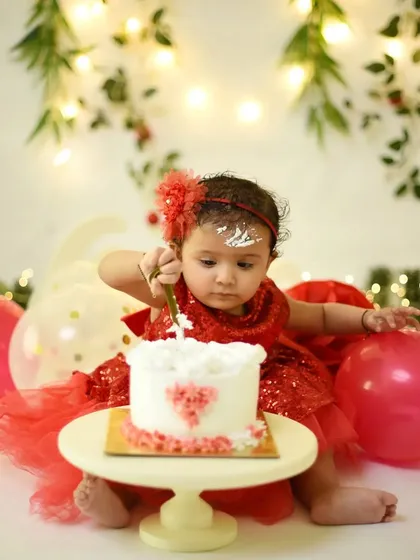 The moment of truth. This little one is carefully investigating her first birthday cake. I love capturing the anticipation right before the smashing starts.
