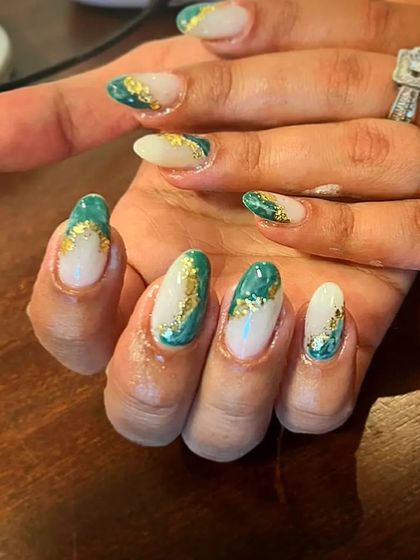 A unique design combining a sheer base with green and gold foil accents for a rich, marble-like effect.