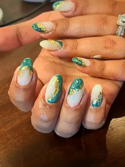 A unique design combining a sheer base with green and gold foil accents for a rich, marble-like effect.