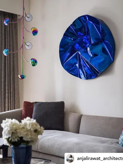 This photo shows how my blue Meteor sculpture coexists with other design elements, like the quirky light fixture, to create a unique and personal space.