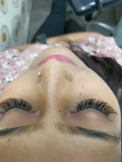 This client's finished volume lashes look full and luxurious. This style eliminates the need for mascara and gives you a ready-to-go look every morning.