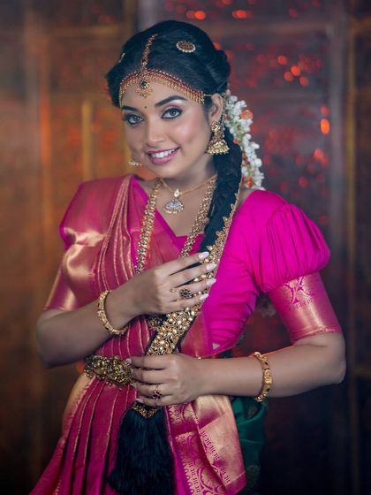 This angle showcases the beautiful traditional braid and the glowing skin.