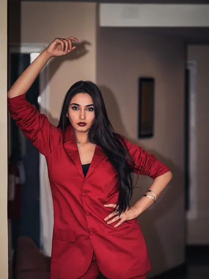 A powerful portrait of Ragini Dwivedi for her brand ambassadorship announcement. The red blazer and direct gaze convey confidence and professionalism, perfect for corporate and commercial campaigns.