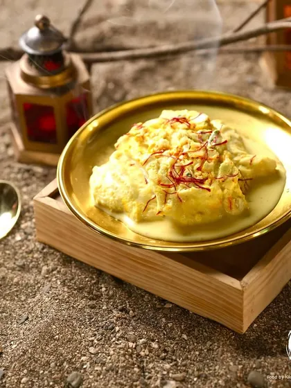 The Classic Saffron Shahi Tukda, presented elegantly on a wooden block. This dessert is a symphony of crispy, creamy, and saffron-dreamy textures and flavors.