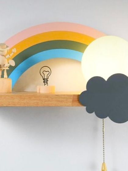 This rainbow shelf comes with a built-in cloud light, adding a warm and magical glow to the room. It’s a multi-functional piece that serves as a shelf, a night light, and a beautiful piece of wall art.