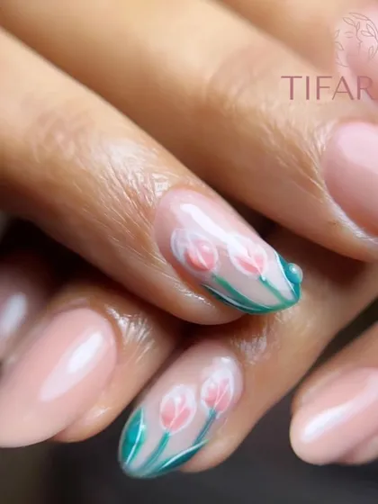 A close-up of the delicate, hand-painted tulips, showcasing the fine detail on this gel polish manicure.