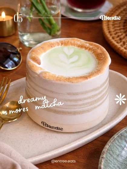 This "Dreamy S'mores Matcha" is all about texture and presentation. The photo highlights the toasted marshmallow topping and the beautiful ceramic mug, making the drink look like a cozy, indulgent treat.