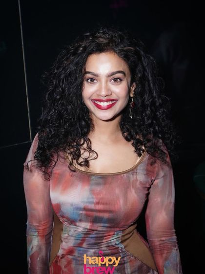 A happy guest smiling for the camera. The positive energy at my parties is contagious.