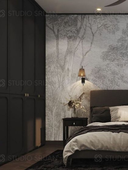 The headboard wall is covered in a serene, forest-themed wallpaper, creating a calming, natural backdrop for the bed.