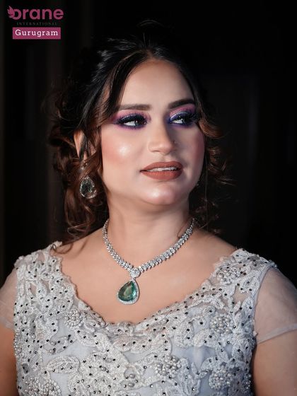 This portrait showcases the complete party look with statement jewelry. I teach my students how to create makeup that shines in professional photos.