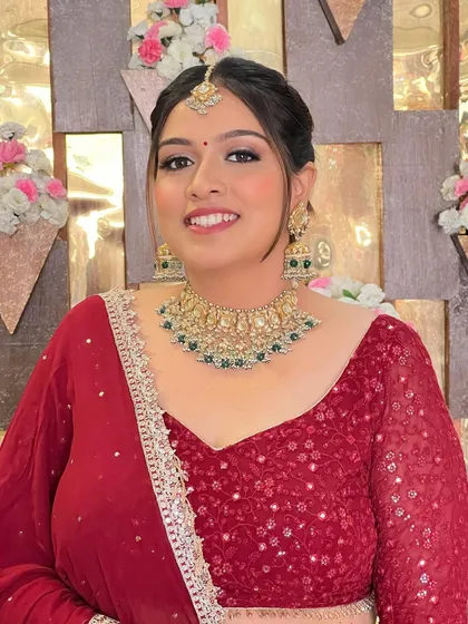 A full portrait of this client in her beautiful red lehenga.