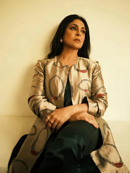 Another seated portrait, this time with a focus on the delicate rings and the rich fabric.