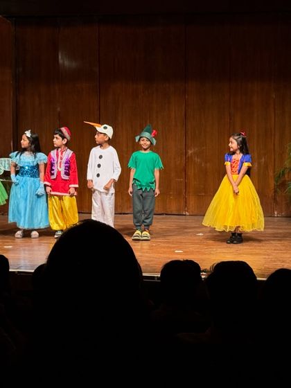 The fairytale cast assembled on stage, a colorful and magical sight.