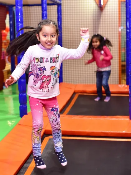 Jumping for joy on the trampoline. It's a fantastic way for kids to get active and improve their gross motor skills.