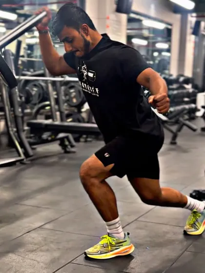 Focused. A shot of me performing a lunge, a fundamental exercise for lower body strength and stability.