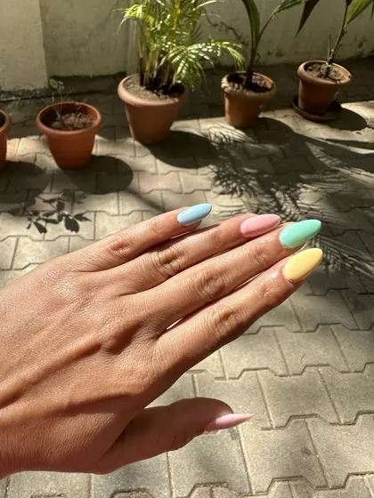 Another first-timer for extensions chose these stunning summer colors. I love these multi-colored pastel nails.