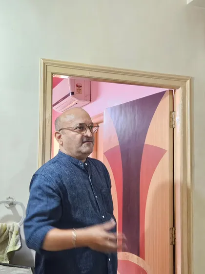 During a home visit, I explain the energetic properties of different areas. Here, I'm discussing the Vastu of a room connected to a washroom.