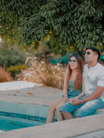 A relaxed photo of a couple dipping their feet in our poolside spot. This set is perfect for capturing casual, summery, and romantic moments.