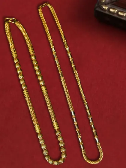 A simple yet powerful flat lay of two different gold chain designs on a solid red background. This approach clearly displays product variety while maintaining a strong visual theme.