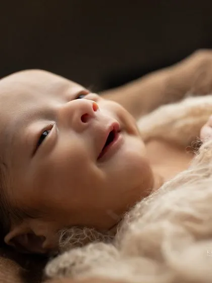 An awake newborn with a beautiful, curious expression. These moments are just as precious as the sleepy ones, capturing the beginning of their personality.
