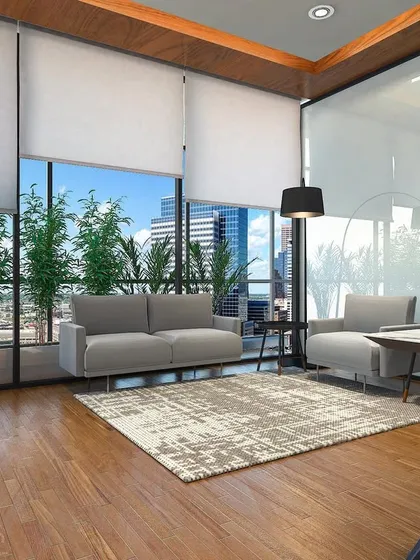 The lounge area within the MD's cabin render. A simple sofa and armchair create a small, informal meeting space, with large plants to bring a bit of nature indoors.