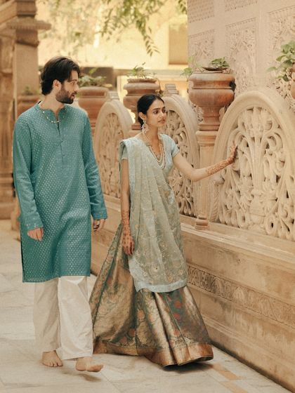 Walking together through a corridor of carved stone, this couple is in a world of their own. I look for these moments of movement and quiet interaction, creating portraits that feel natural and unstaged.