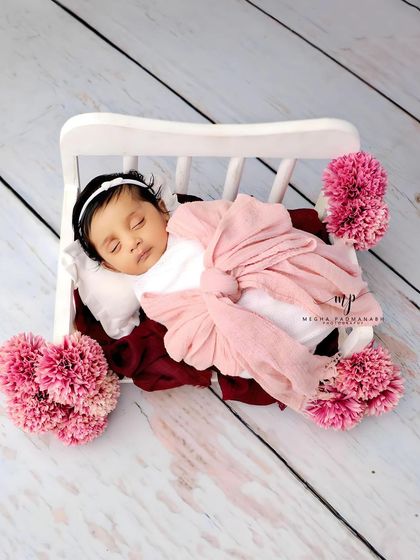 A wider view of the pink diwan setup, showing the full arrangement of props.