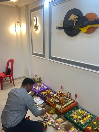 A client performing puja rituals during his housewarming ceremony in Kalyan West. The setup includes various elements to appease the Vastu Purush and invite divine blessings.