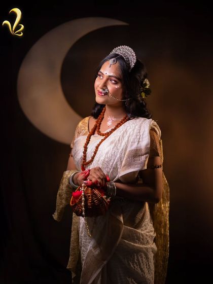 This shot captures the essence of the Brahmacharini concept. The styling, with a simple white saree and minimal adornments, emphasizes the theme of unwavering focus and the inner strength that comes from a period of learning and growth.