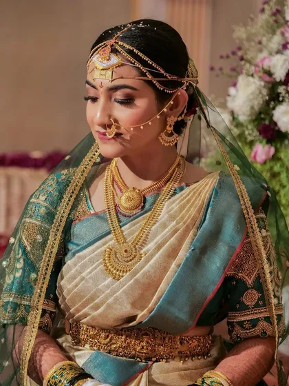 A closer view of the Coorgi bride. Her makeup features defined eyes and a soft lip, with a flawless base that enhances her natural complexion.