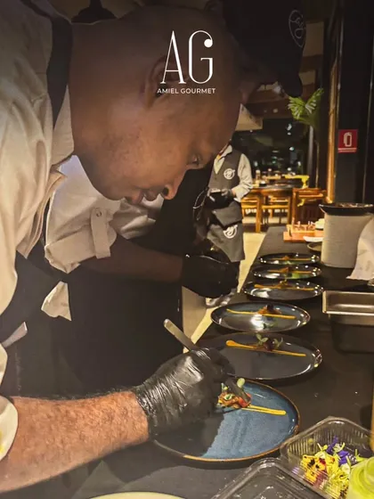 A glimpse of our team plating canapés at a recent event. Let us cater your next unforgettable experience with our passion and attention to detail.