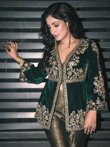 A beautiful, posed shot of Rupali Jagga. The intricate details of her outfit are perfectly matched by the bold design of our silver ring.